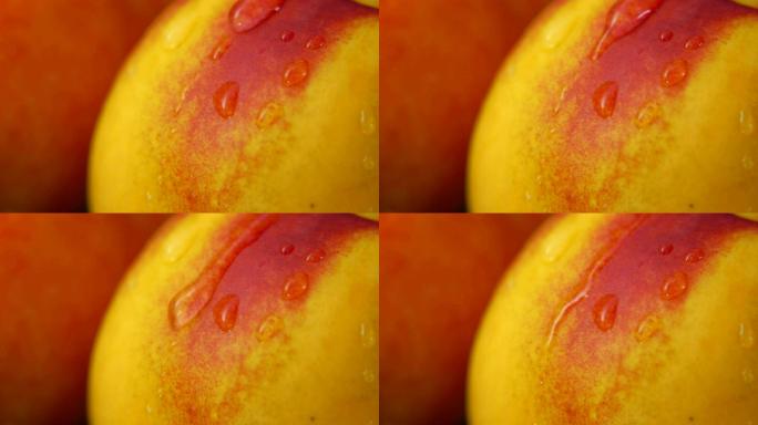 一滴水慢慢从油桃表面往下流的特写镜头