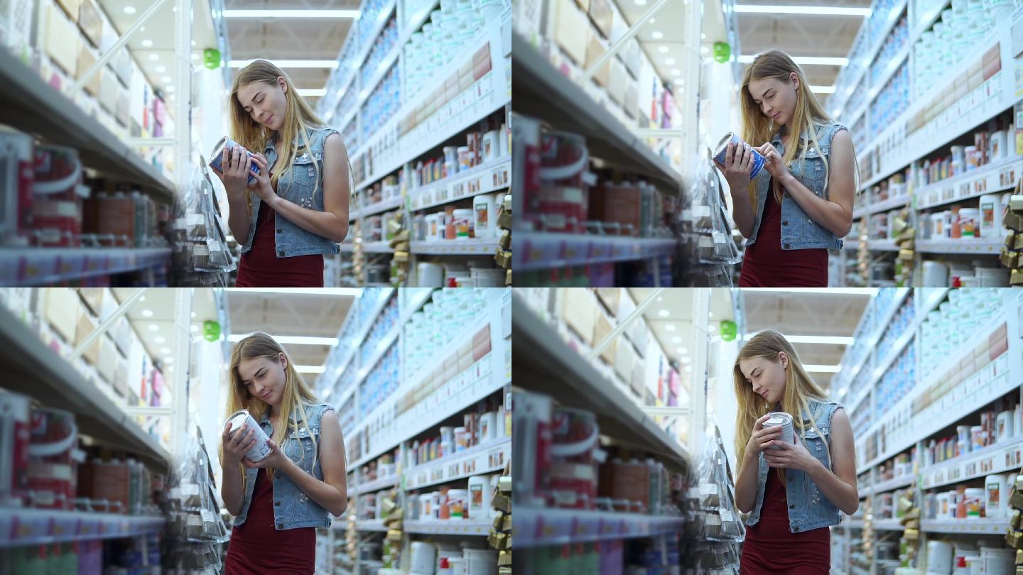 在超市挑选罐头的女孩