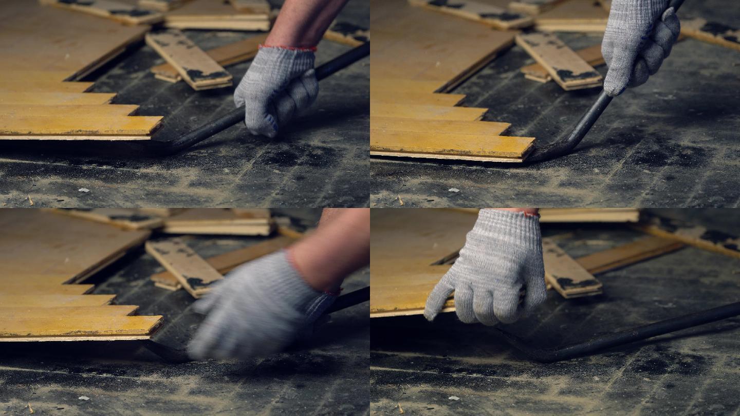 工人用轮胎熨斗工具移除旧拼花地板