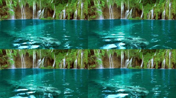 森林湖中的瀑布高山流水大自然生态绿色风光