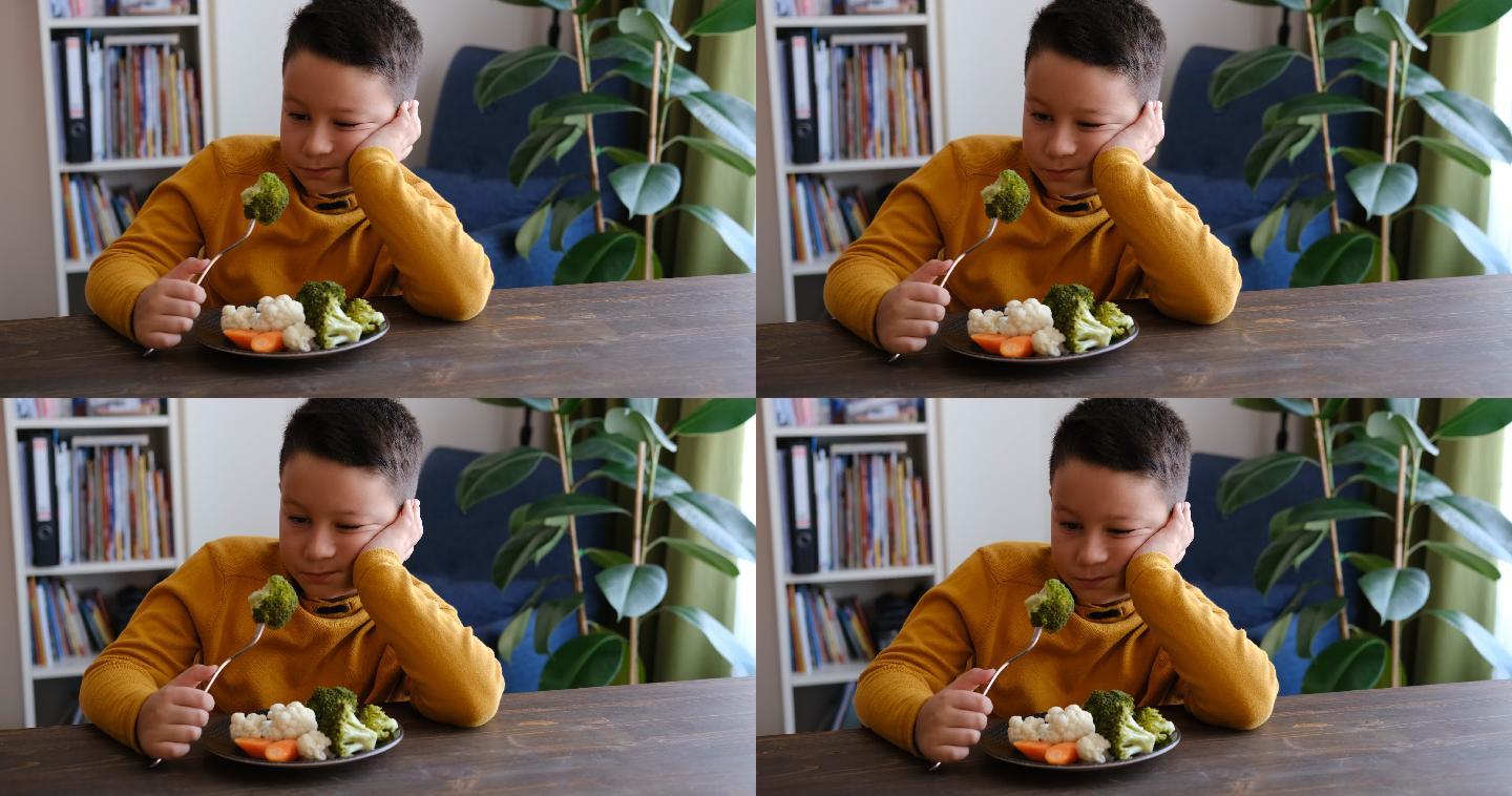 讨厌蔬菜的小男孩视频素材儿童饮食吃蔬菜
