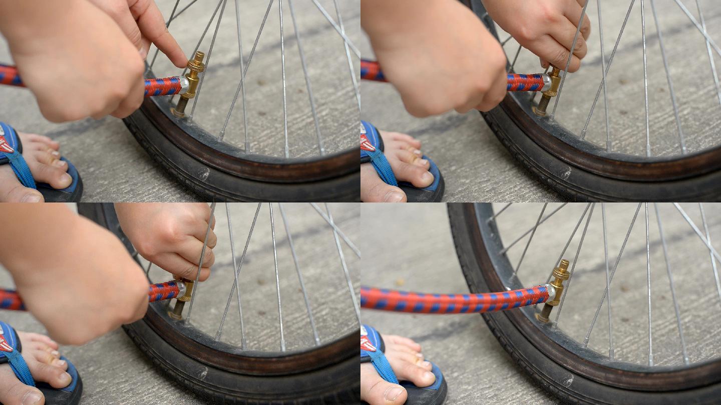 男孩在骑车前给自行车轮胎充气