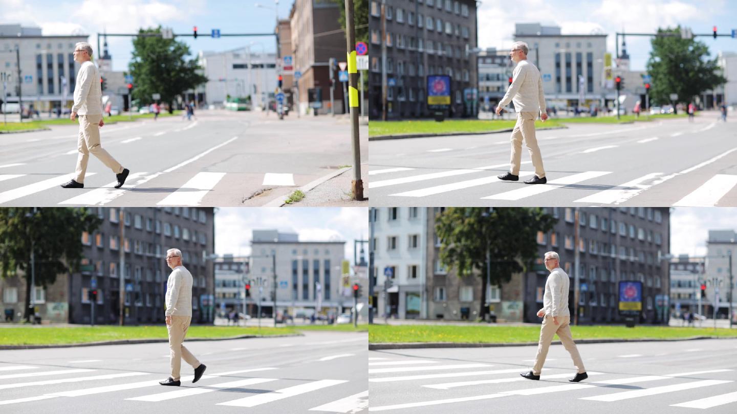 沿着城市人行横道行走的老人