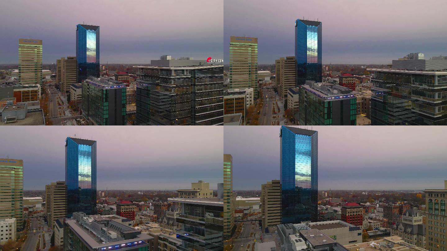 日出时从市中心飞向蓝色的金融办公大楼