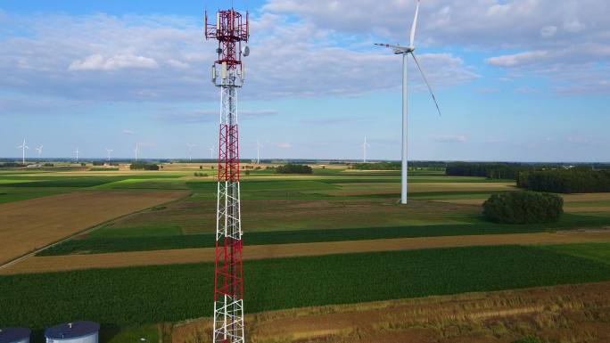 5G塔和风车绿色节能环保清洁能源田园麦田