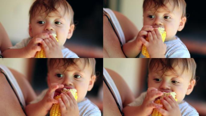 可爱的婴儿吃玉米放松