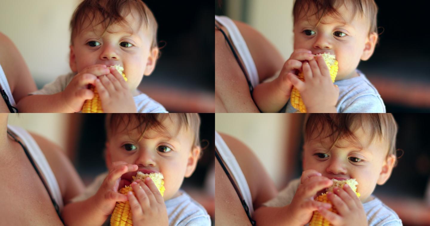 可爱的婴儿吃玉米放松