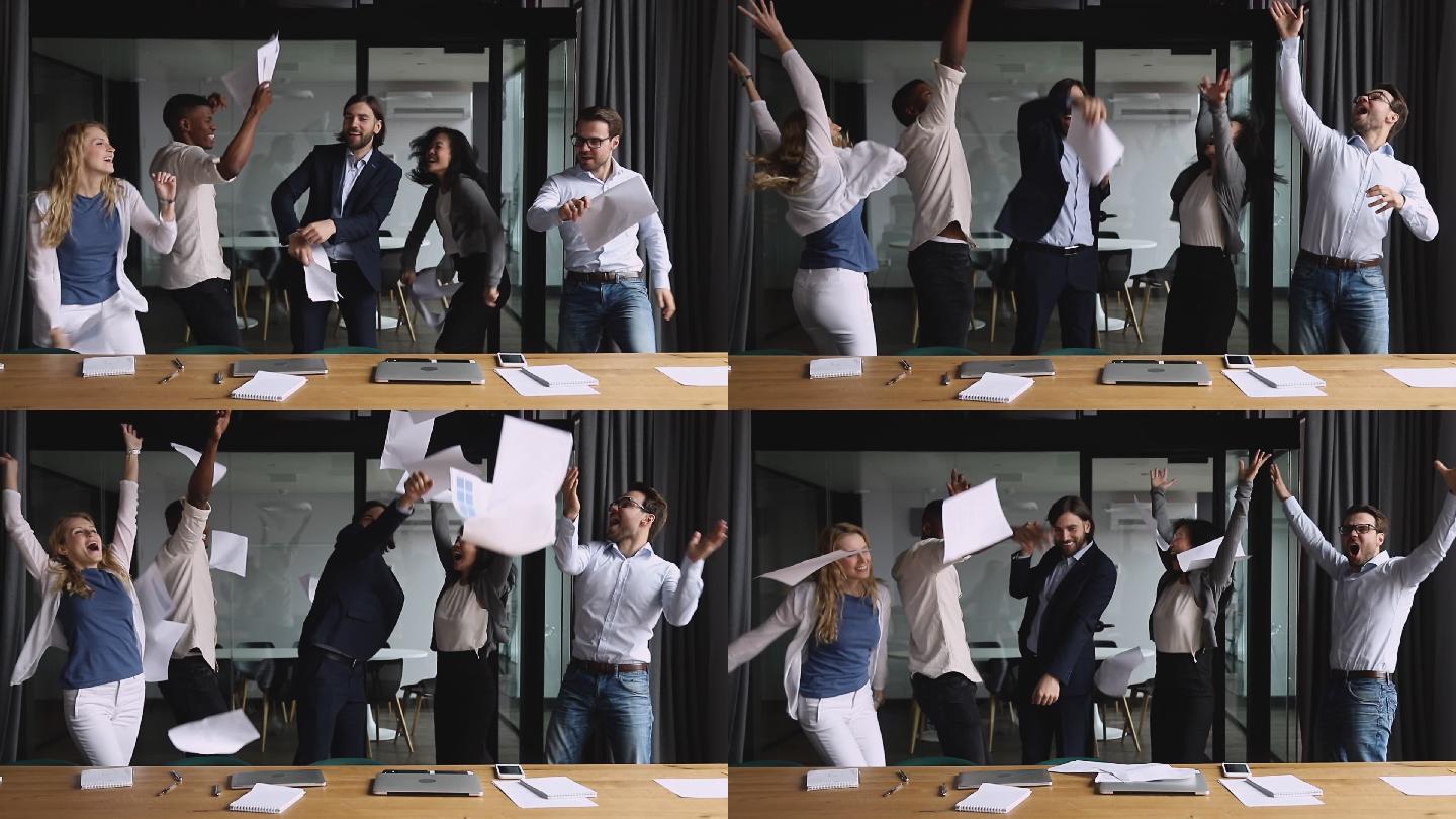 快乐的同事在办公室跳舞