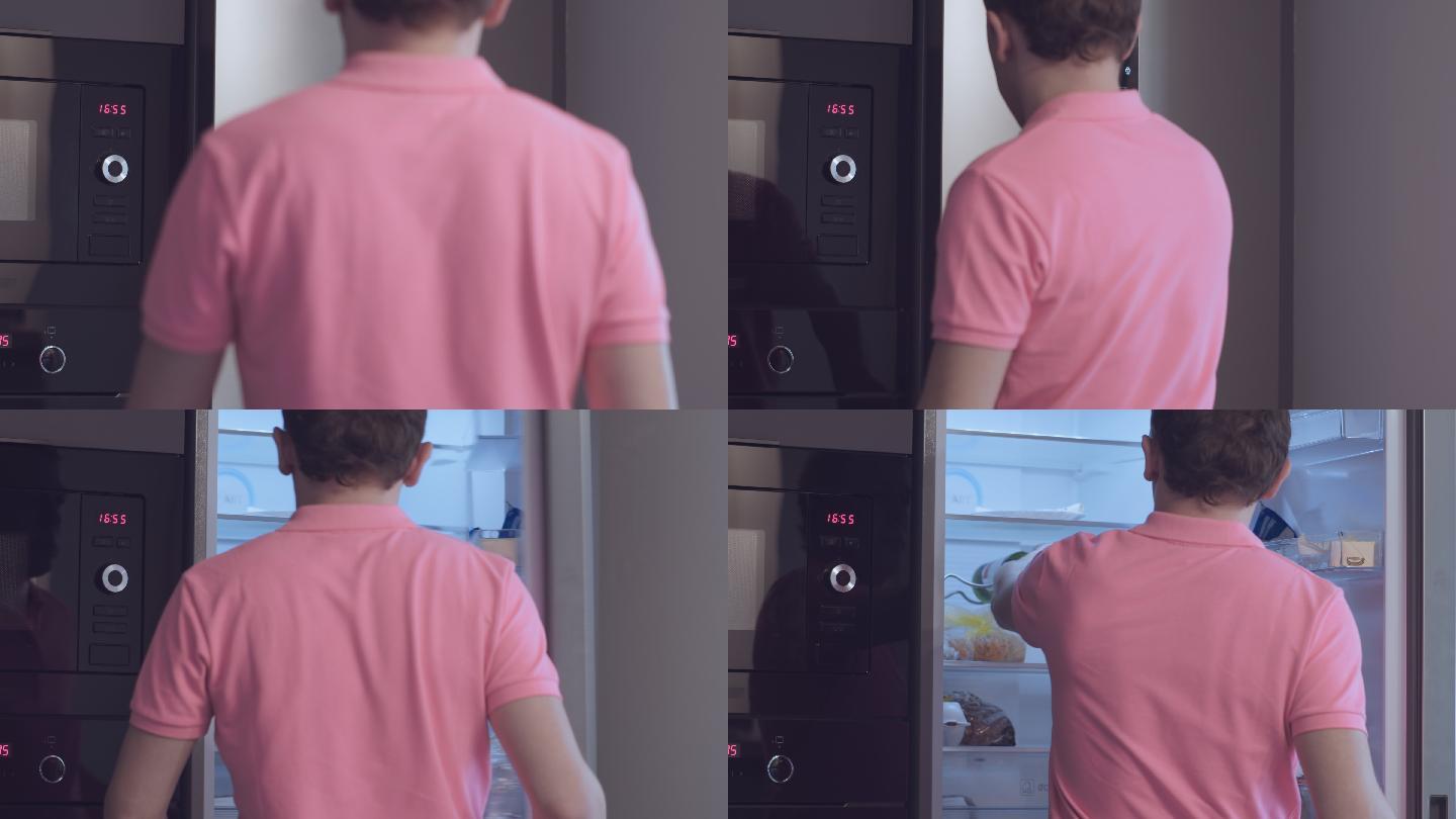 一个穿着粉色T恤的男人走向冰箱