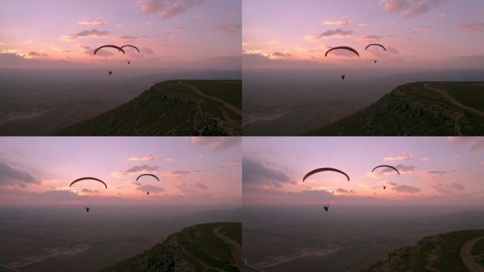 日落中的滑翔伞史诗般的极限运动