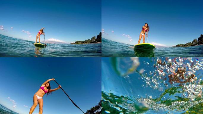 女孩在夏天用冲浪板划水