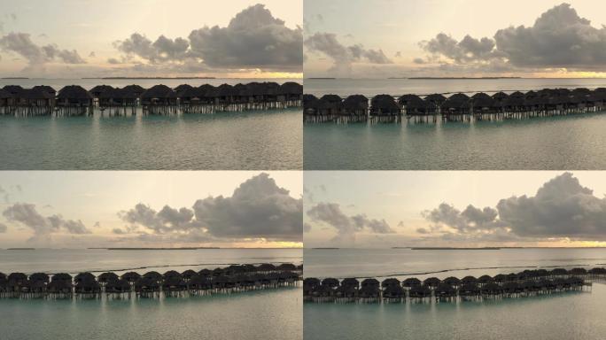 天堂里美丽的日出海上建筑岛屿海岛旅游度假