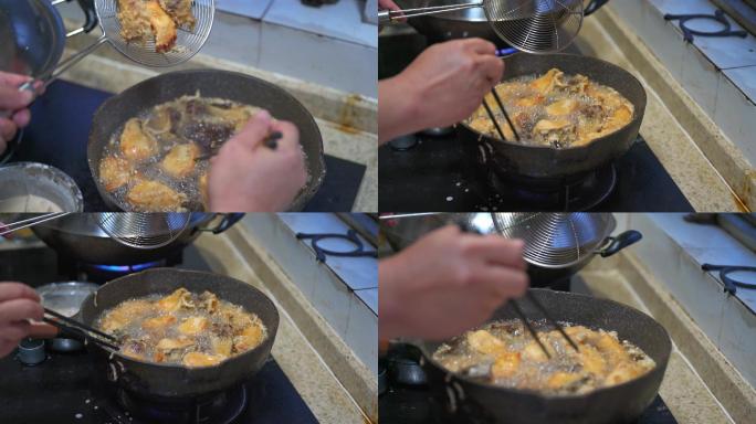 一位厨师在制作金黄诱人的油炸鱼块