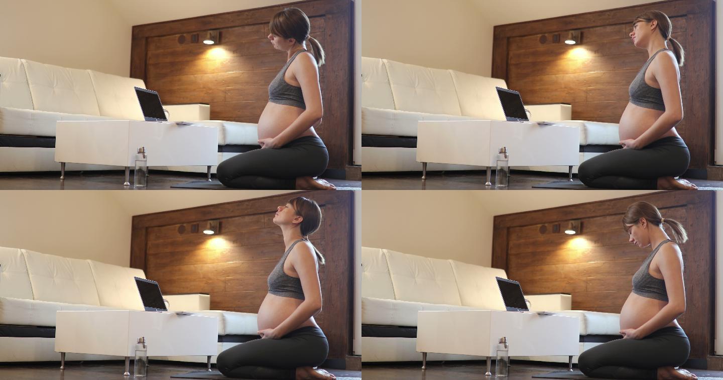 孕妇在家做瑜伽