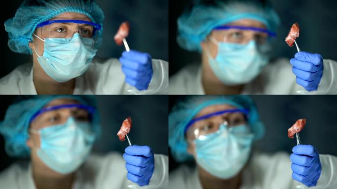 实验室助理分析感染的肉样本、癌组织、转移
