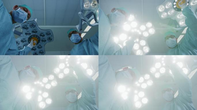 医生在俯身检查患者时打开手术灯