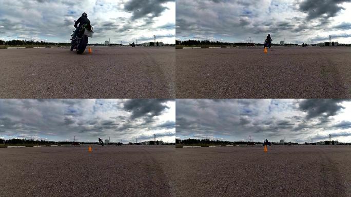 骑着摩托车经过摄像机