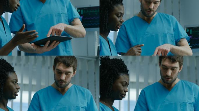 男护士和女护士在交谈时使用平板电脑