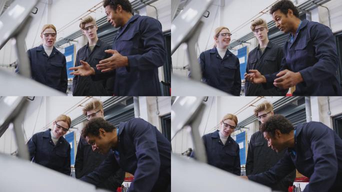 男导师和学生一起研究汽车发动机