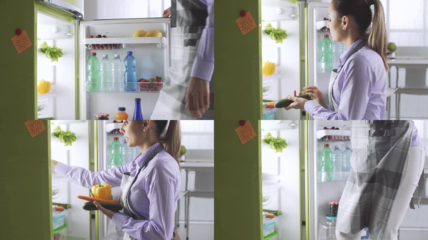从冰箱里拿新鲜蔬菜的女人