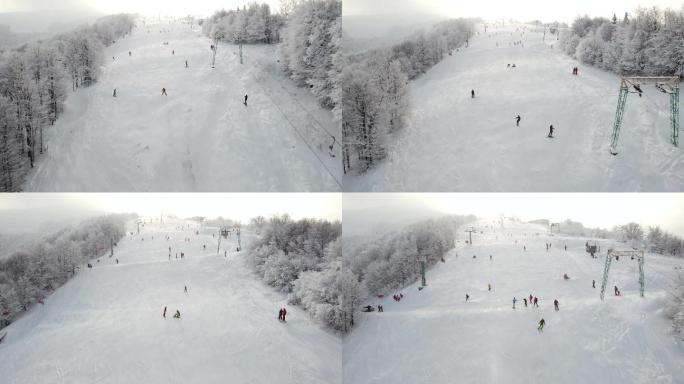 游客和度假者去山顶滑雪