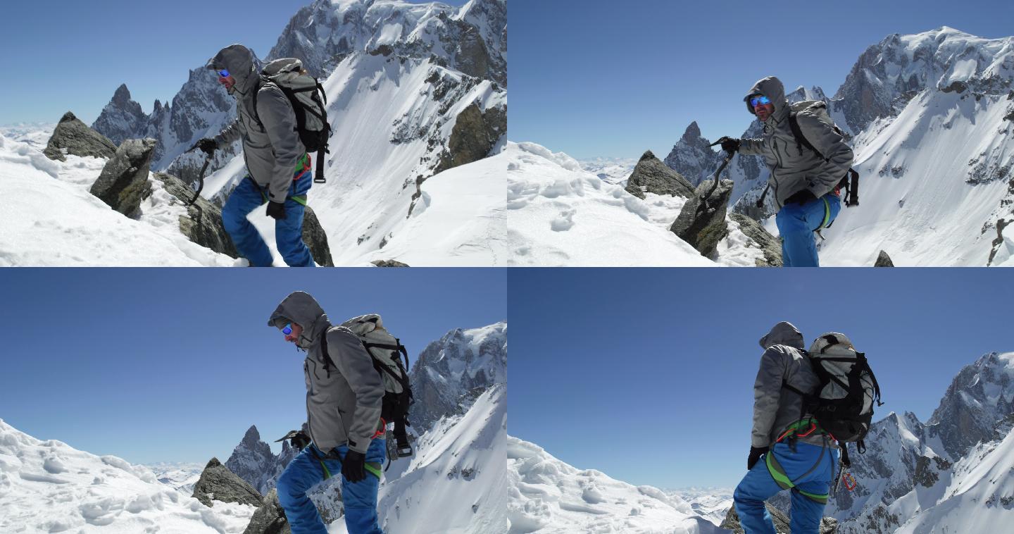 登山者用冰斧到达雪山顶。