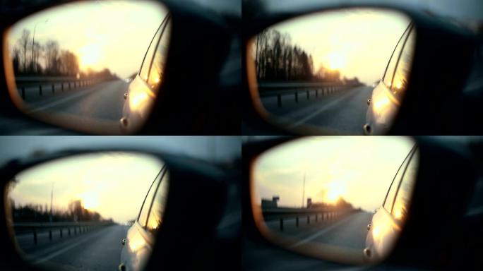 日落时后视镜中的道路