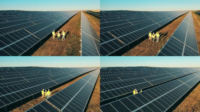 专家们走过一座太阳能发电厂的俯视图