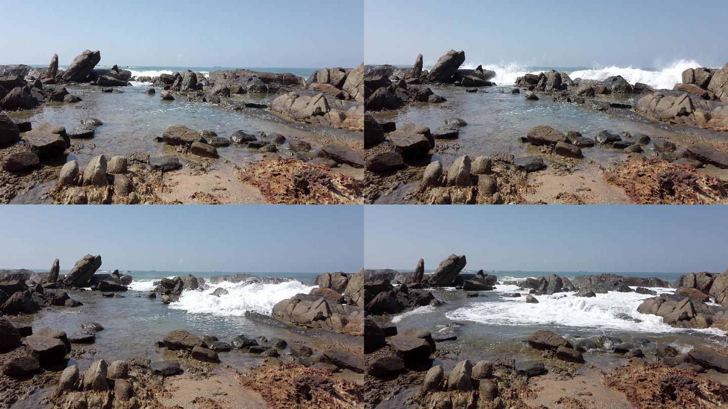 海浪拍打着岩石，填满了潮水滩