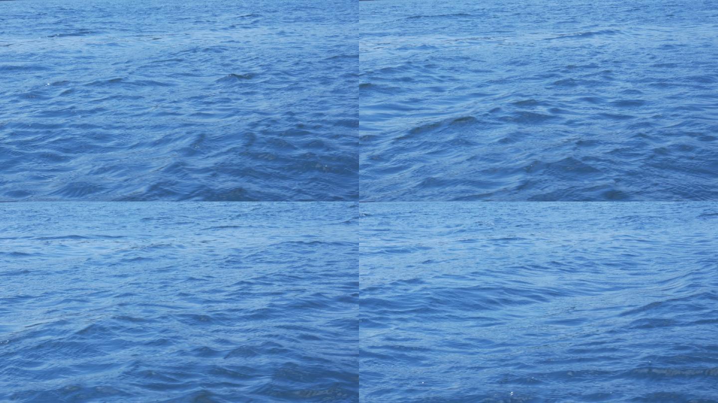 一片蓝色的水域滔滔江水海水海浪水波水纹