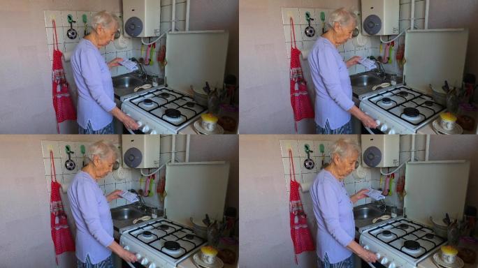 悲伤的老妇人在家检查煤气单。