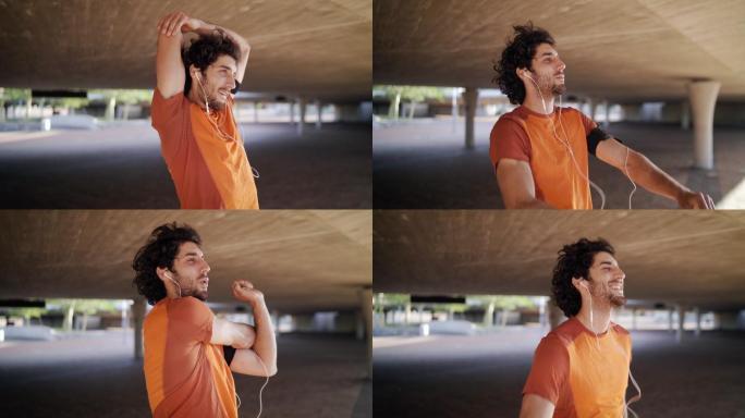 男人一边听音乐一边在户外做热身运动