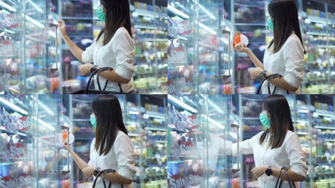 戴着医用防护口罩的女人在超市购物