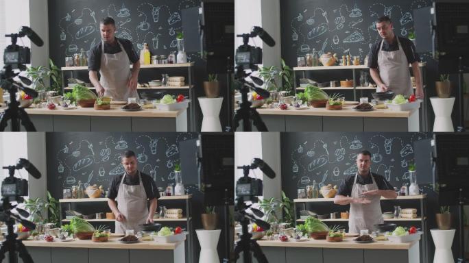 男厨师为Vlog煎食物并在镜头前讲话