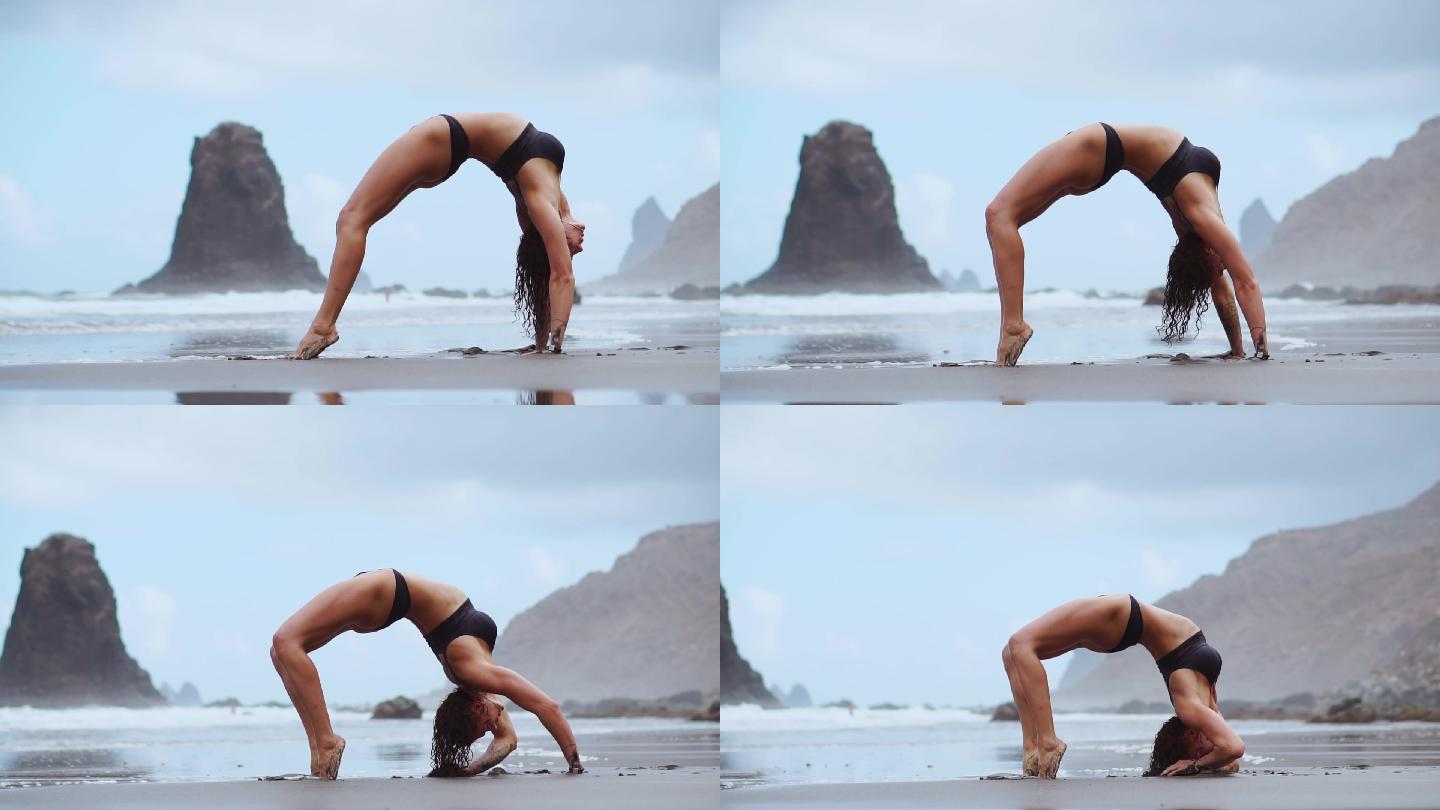 一个女孩在海滩的上练习瑜伽动作