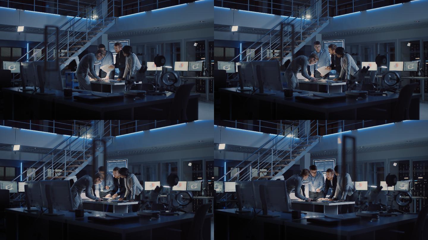 不同的电子开发工程师团队站在办公桌旁处理文件