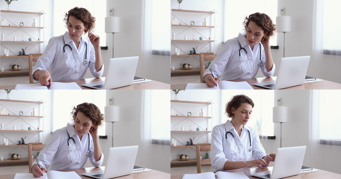 女医生穿着白色外套用笔记本电脑写笔记