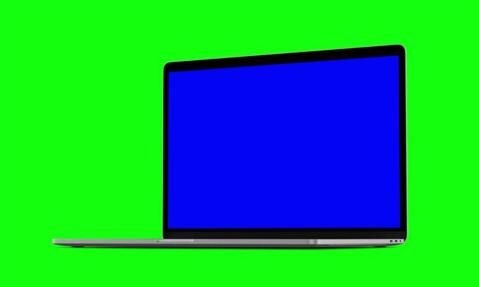 笔记本电脑在绿色背景上打开蓝色屏幕。