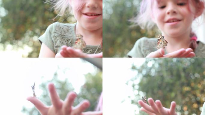 小女孩看着蝴蝶从手中飞走
