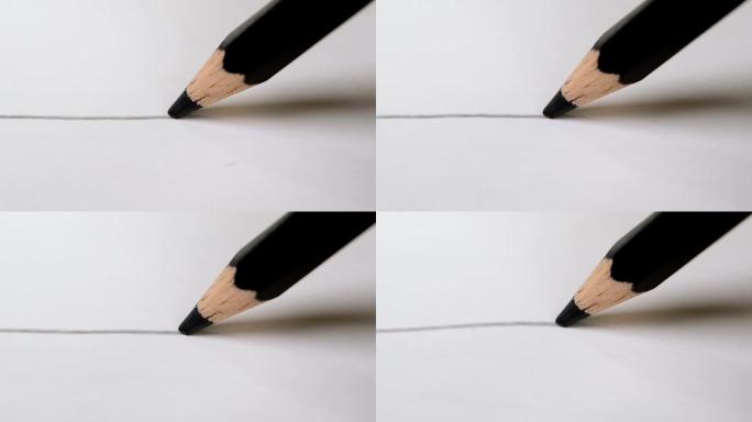 用黑色铅笔在白色画纸上画黑线