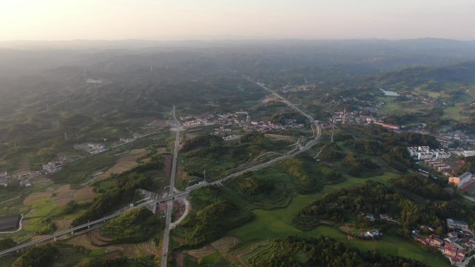 航拍大山中的公路乡村田园风光