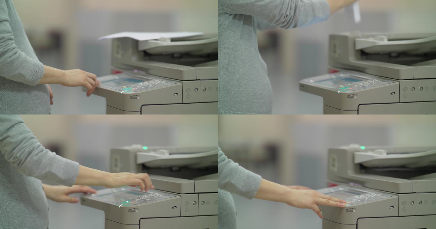孕妇使用复印机复印孕期上班A4纸