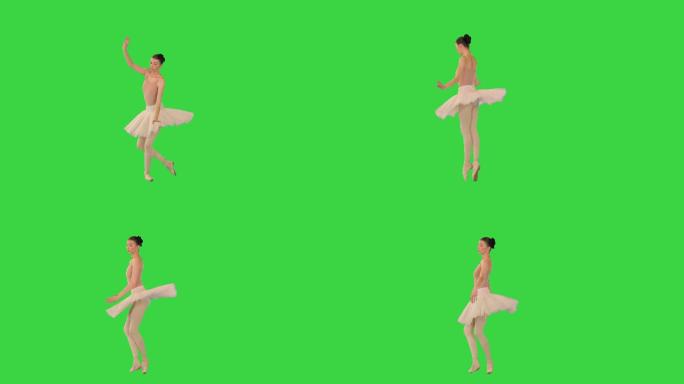 身着芭蕾舞裙的专业芭蕾舞演员在绿色屏