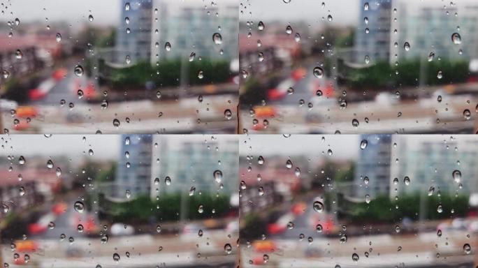玻璃窗上的雨滴散焦水潮湿