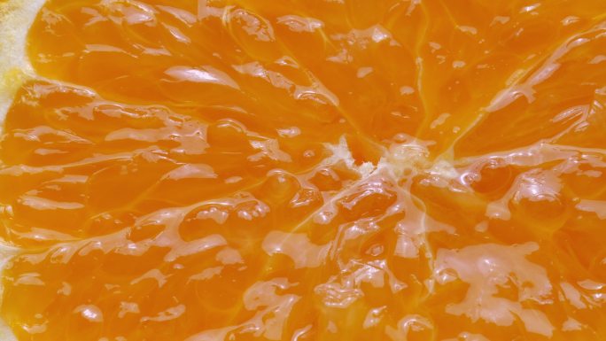 榨汁的柑橘水果慢动作入水创意特写主图视频