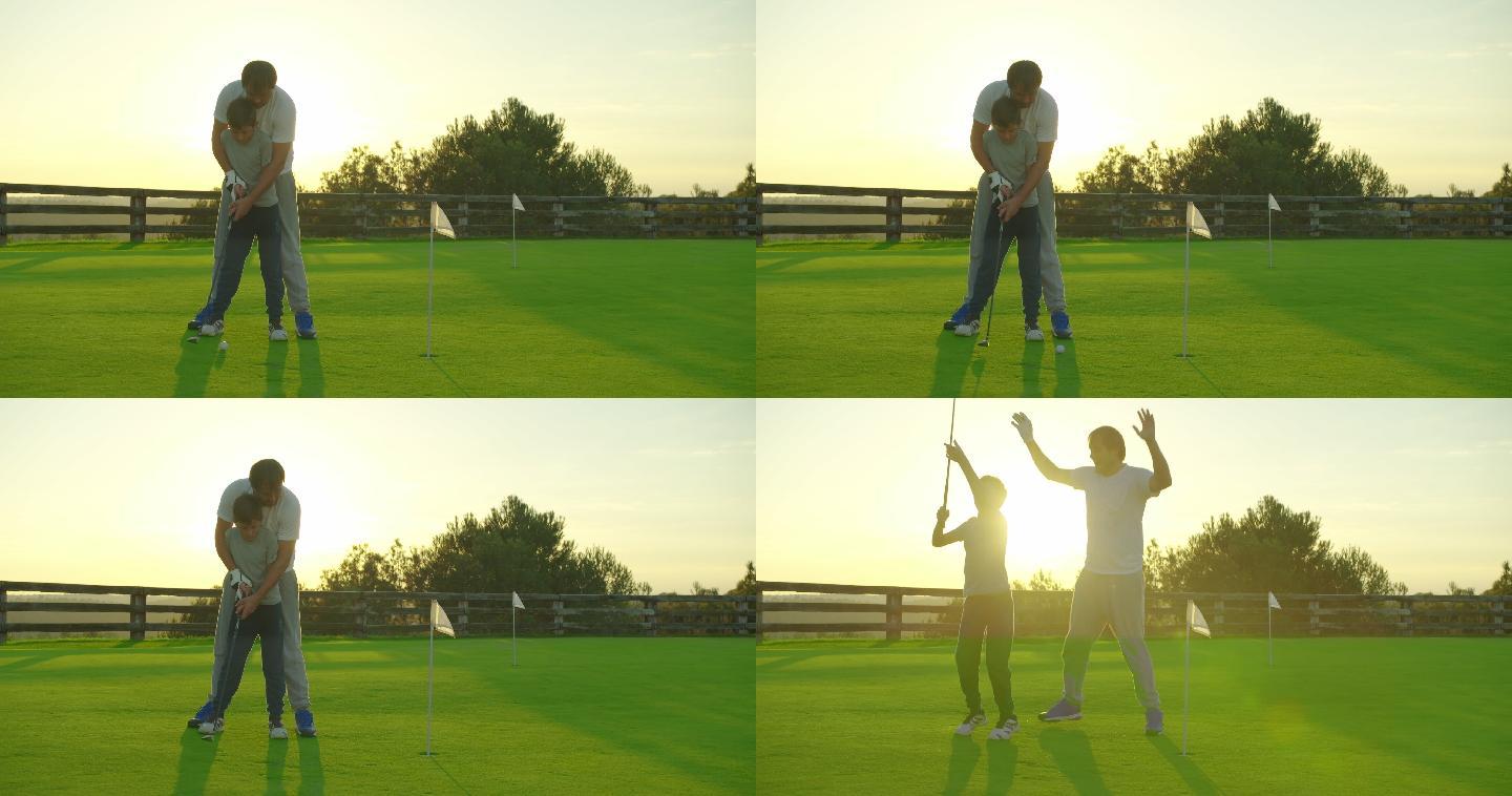 男人和儿子在高尔夫球场打高尔夫