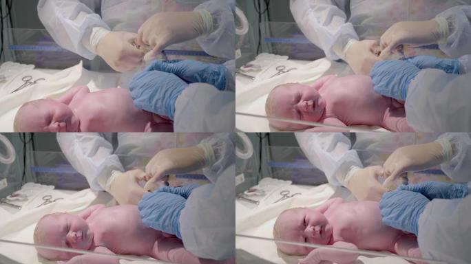刚出生的新生儿产房接生剪脐带