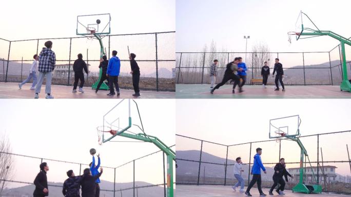 乡村篮球场上一群少年打篮球