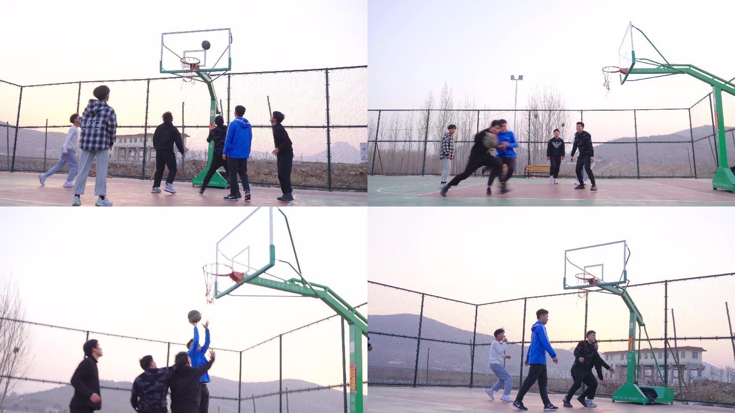 乡村篮球场上一群少年打篮球