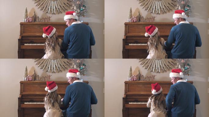 女孩和她的父亲坐在钢琴前